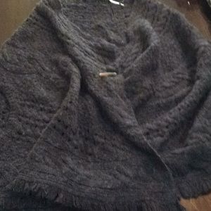 Pancho with sleeve hole and button